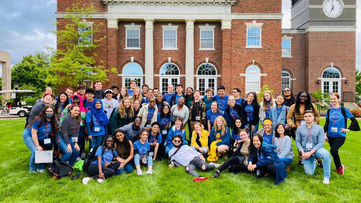 Picture of the 2022 class on a green lawn outside.